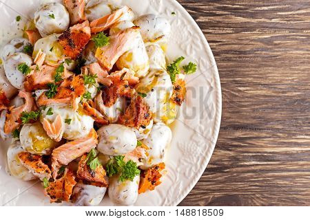 Salmon and young potato warm salad with a lemony yogurt dressing.