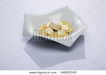 Beautiful white vase with a dessert on a white background
