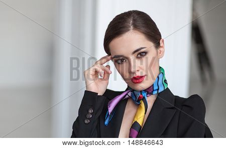 close up portrait of young smart business woman thinking in blurred interior