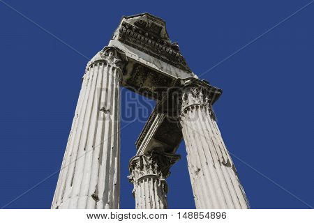 Three ancient columns form Temple of emperor Vespasianus ruins in Roman Forum