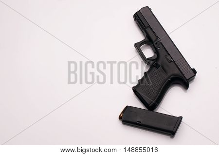 gun 9 mm. with magazine on white background