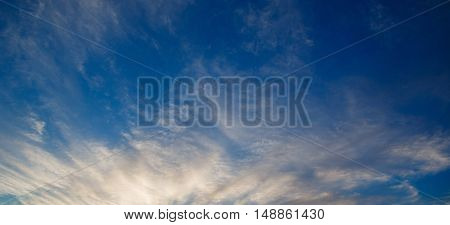 Cumulus clouds against a blue sky. Mostly Cloudy. Synoptics.