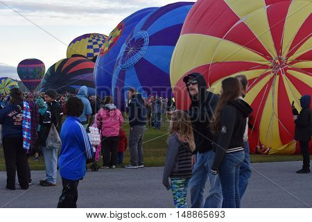 QUEENSBURY, NY - SEP 24: Balloon launch at dawn at the 2016 Adirondack Hot Air Balloon Festival held from Sep 22-25. Thousands of people attended the festival which is the largest of its kind on the East coast.