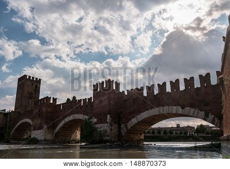Beautiful photo of medieval stone bridge Ponte Scaligero built in 14th century near Castelvecchio. Verona, Italy.