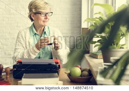 Senior Adult Using Typerwriter Typing Concept