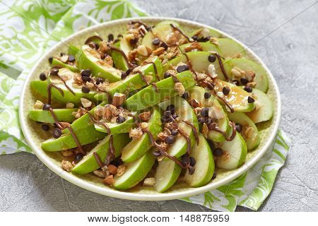 Loaded apple nachos with caramel, chocolate chips, granola and almonds
