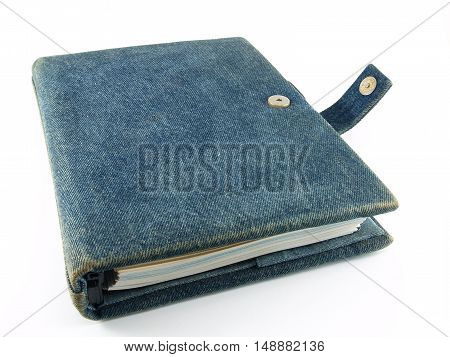 close up closed notebook diary isolated on white background, handmade book with denim cover