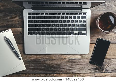 Stilllife With Laptop Near Cup With Tea, Smartphone And Pen On Scetchbook On Wooden Table. Mock-up