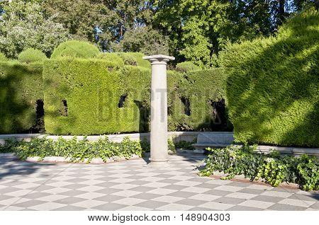 Column and garden. Picture taken in Cecilio Rodriguez's Garden Retiro Park Madrid Spain