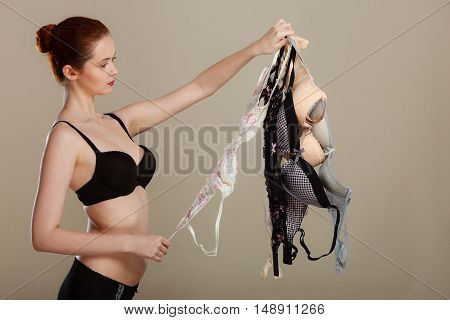 Woman Choosing Bras To Wear