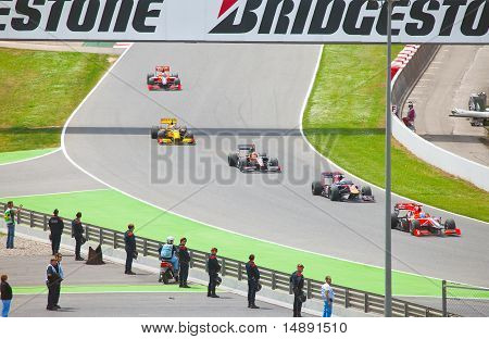 Racing cars on a circuit during The Formula 1 Grand Prix at autodrome 