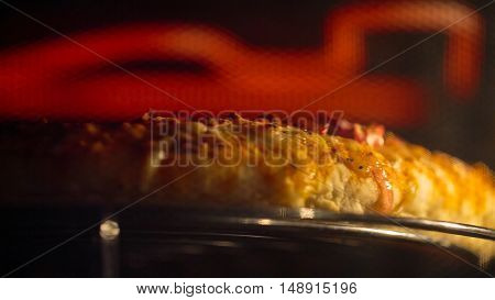 Delicious pizza in the oven. Grilling pizza. Pizza Oven. Hot pizza closeup