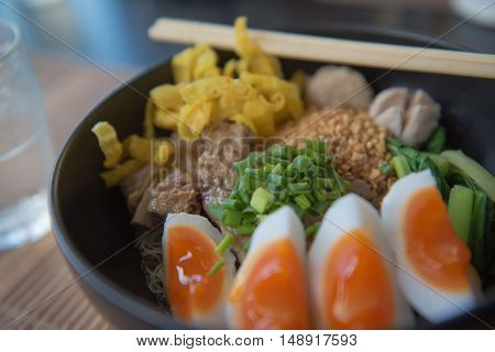 closeup Thai noodles with boiled in a bowl. At restaurant