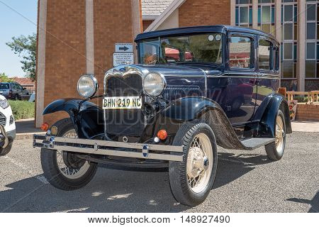 KIMBERLEY SOUTH AFRICA - SEPTEMBER 24 2016: A public display of new and vintage cars at a fair at the Dutch Reformed Church Vooruitsig in Kimberley