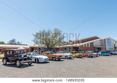 KIMBERLEY SOUTH AFRICA - SEPTEMBER 24 2016: A public display of new and vintage cars at a fair at the Dutch Reformed Church Vooruitsig in Kimberley