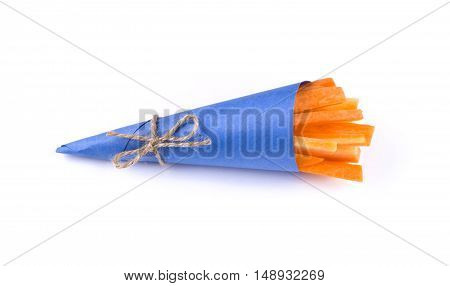 Carrot sticks in a blue envelope. Blue bag tied with string isolated Markovna sticks inside.