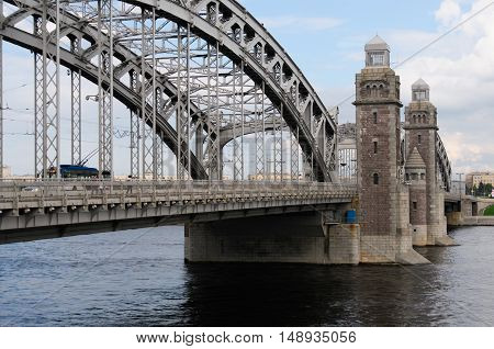 Historic bridge of Emperor Peter the Great over river Neva in Saint-Petersburg,  later name - Bolsheohtinsky. Three-span metal bridge, central part is adjustable. Towers - govern divorce of bridge.