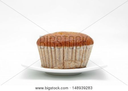 Banana cupcake with chololate on white plate