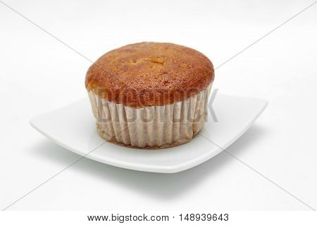 Banana cupcake with chololate on white plate