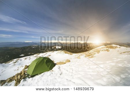Camping on the top of the mountain in winter.