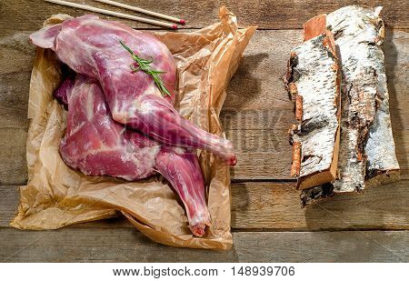 Raw Lamb Shank  On  Rustic Wooden Board.