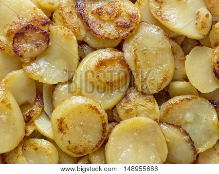 close up of rustic german bratkartofflen fried potatoes food background