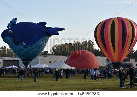 QUEENSBURY, NY - SEP 24: Balloon launch at dawn at the 2016 Adirondack Hot Air Balloon Festival held from Sep 22-25. Thousands of people attended the festival which is the largest of its kind on the East coast.