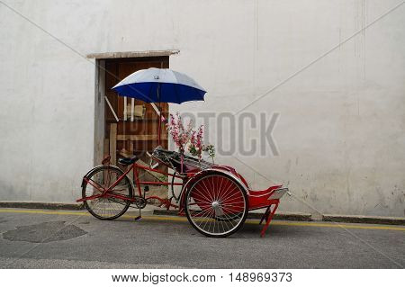 Georgetown Penang Malaysia - April 18 2015: Classic local rickshaw in George Town Penang in Malaysia