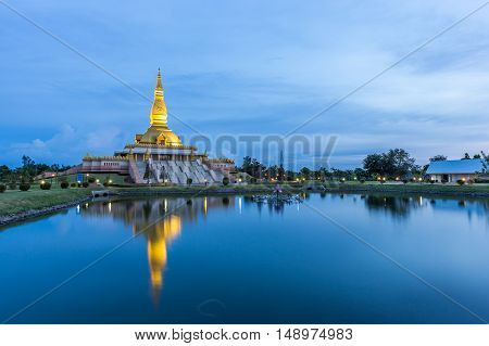 Maha Mongkol Bua Pagoda In Roi-ed Thailand At Sunset.