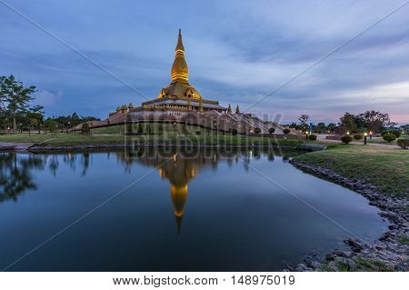 Maha Mongkol Bua Pagoda In Roi-ed Thailand At Sunset.