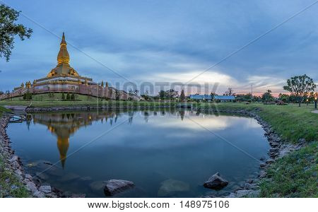 Famous Maha Mongkol Bua Pagoda In Roi-ed Thailand At Sunset.