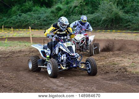 Unidentified Racer Rides A Quad Motorbike.