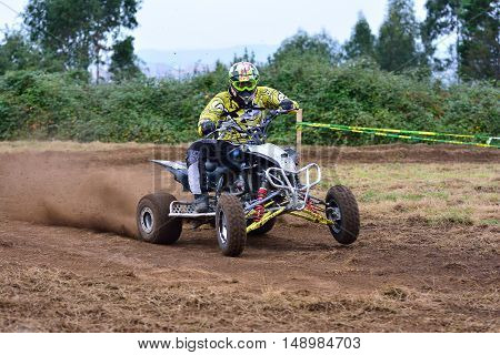 Unidentified Racer Rides A Quad Motorbike.