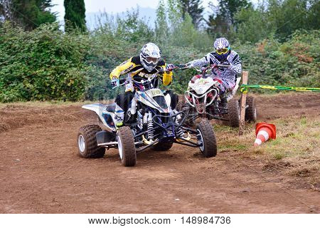 Unidentified Racer Rides A Quad Motorbike.