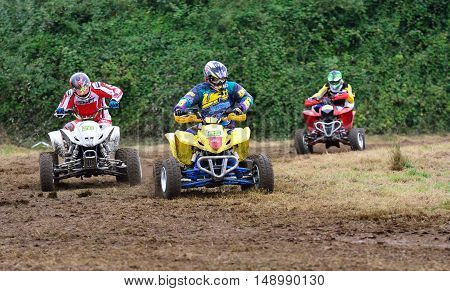 Unidentified Racer Rides A Quad Motorbike.