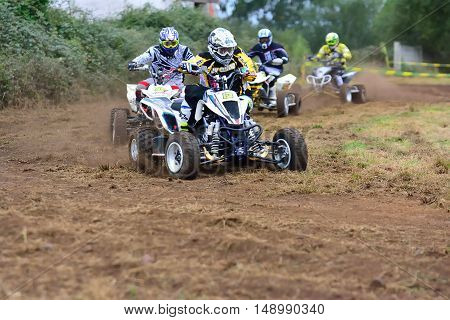 Unidentified Racer Rides A Quad Motorbike.