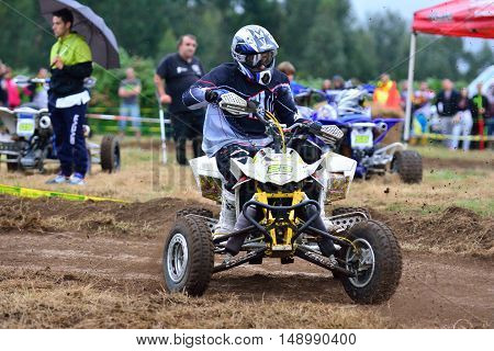 Unidentified Racer Rides A Quad Motorbike.