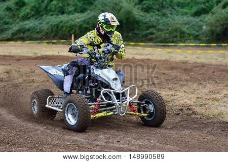 Unidentified Racer Rides A Quad Motorbike.