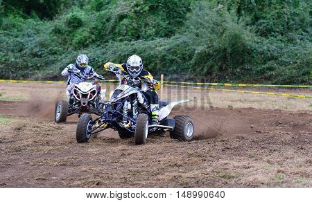 Unidentified Racer Rides A Quad Motorbike.