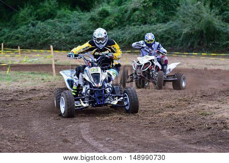 Unidentified Racer Rides A Quad Motorbike.