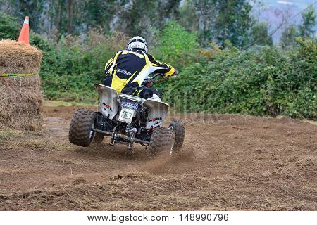 Unidentified Racer Rides A Quad Motorbike.