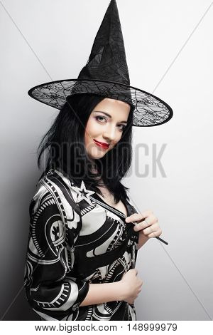 Funny Witch. Young happy woman with canival hat.
