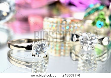 Close-up Of Artificial Stone Ring Jewelery With Reflection And Another Rings In Background