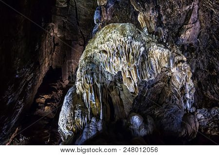 Illuminated Multicolored Stalactites In Cave Han-sur-lesse In Belgium