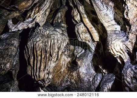 Illuminated Multicolored Stalactites In Cave Han-sur-lesse In Belgium