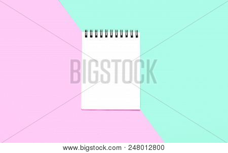 Empty Notebook Or Notepad On Pink And Blue Background. Creative Minimalism Chancery Concept. Top Vie