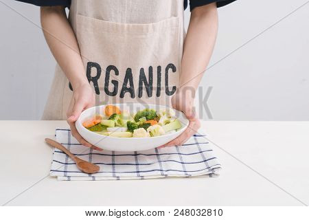 Fresh Vetgetables,carrots,long Beans, Boiled Corn In Hand On White Table