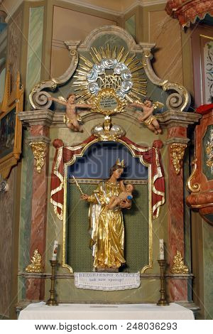 ZACRETJE, CROATIA - AUGUST 06: Virgin Mary with baby Jesus, statue on the altar of Our Lady in the Parish Church of the Holy Cross in Zacretje, Croatia on August 06, 2017.