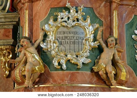 ZACRETJE, CROATIA - AUGUST 06: Angels, statue on the pulpit in the Parish Church of the Holy Cross in Zacretje, Croatia on August 06, 2017.