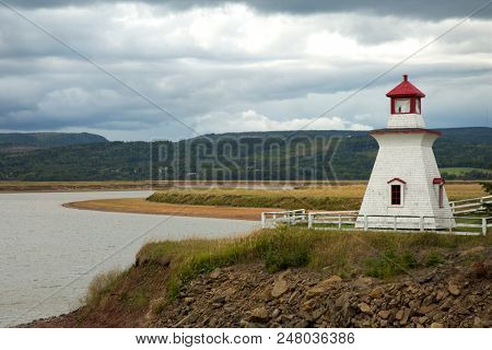 Anderson hollow lighthouse with a grey cloudy sky in New Brunswick in Canada